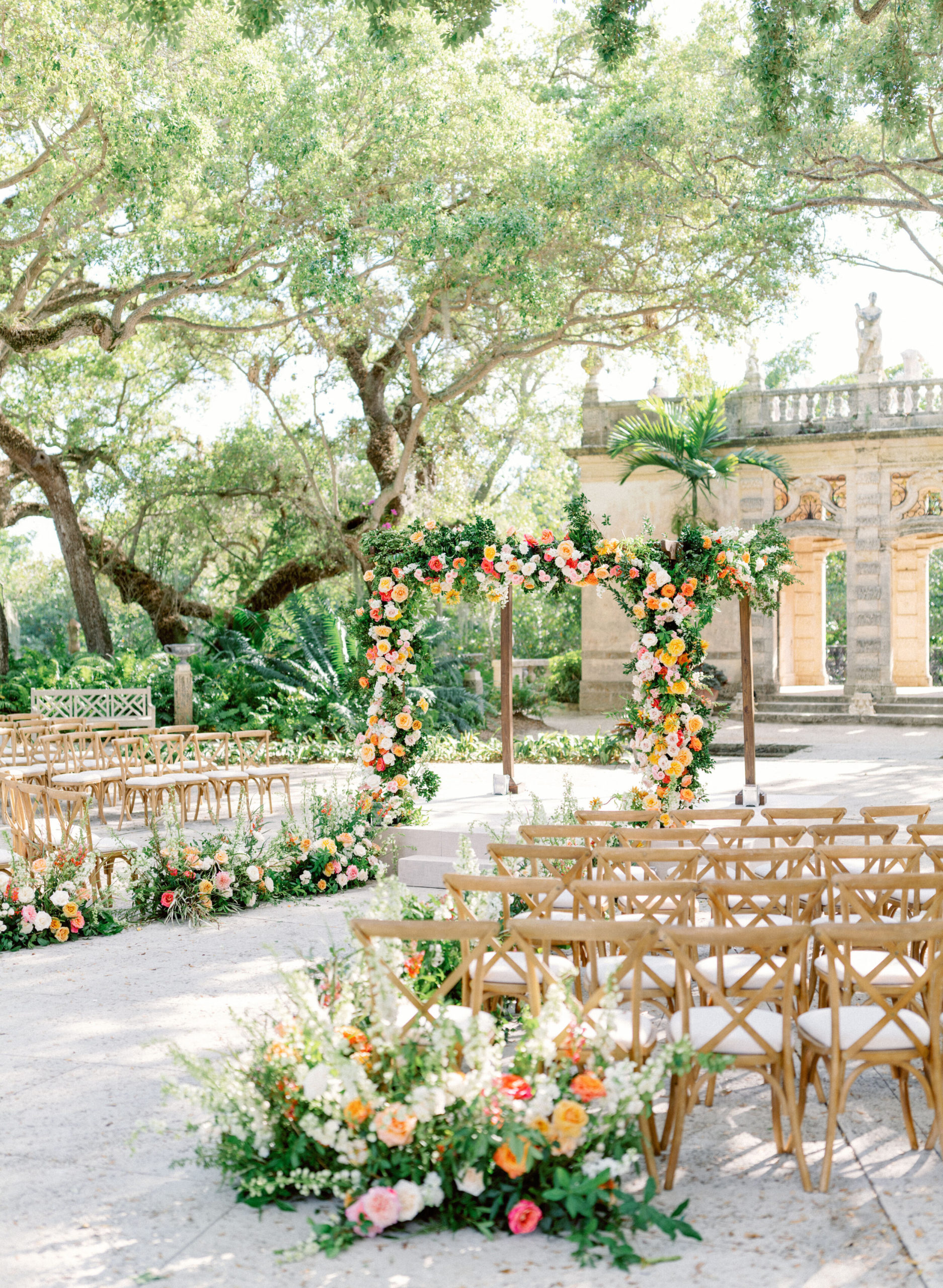 Aisle flowers for outdoor ceremony at Vizcaya Museum