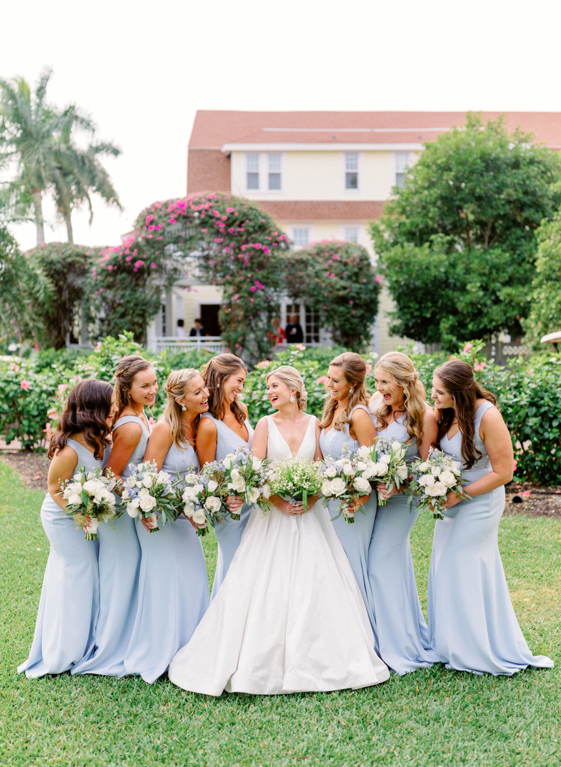 brides with her bridesmaids in blue at Gasparilla Inn
