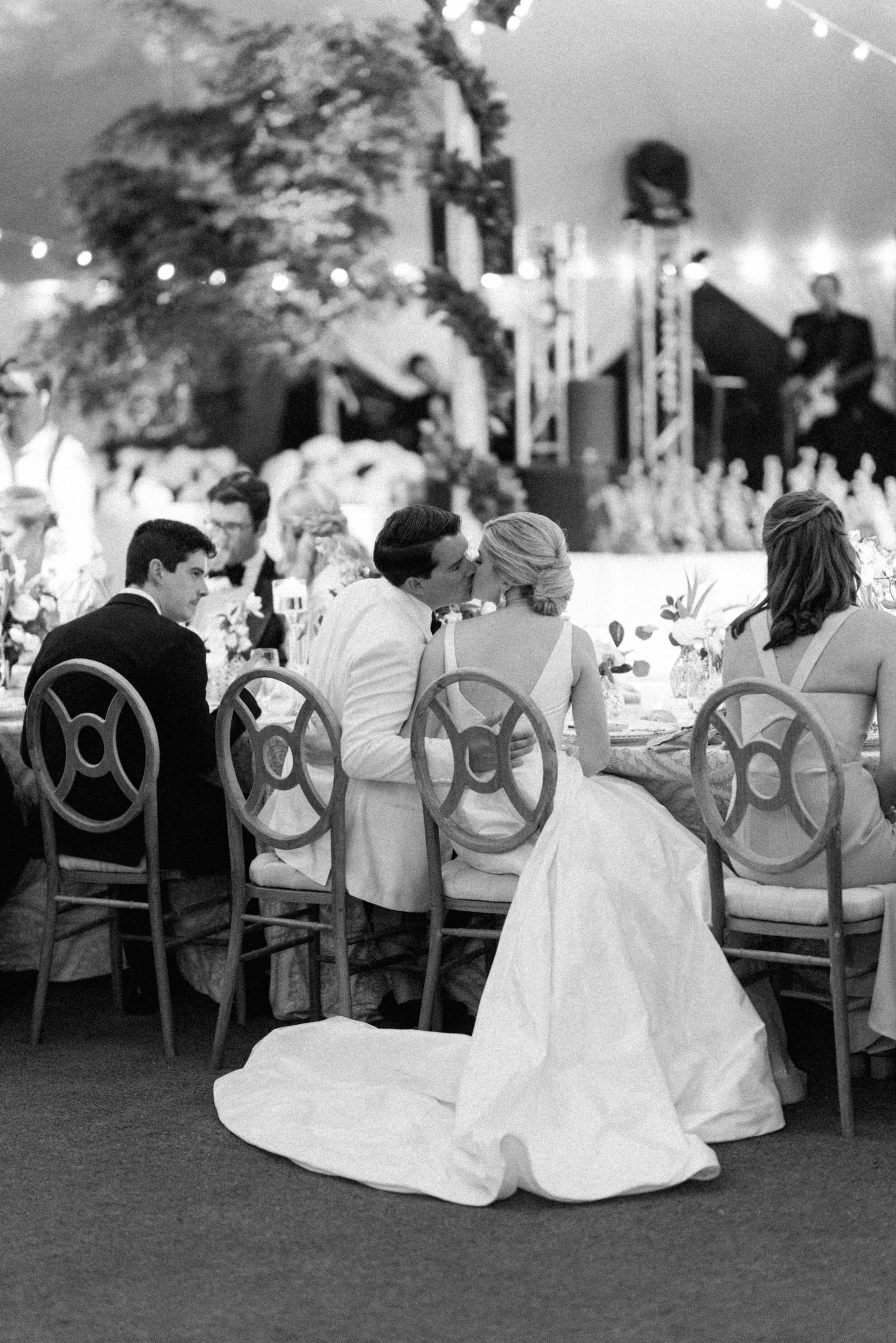 black and white photo of couple kissing during thier Gasparilla Inn reception
