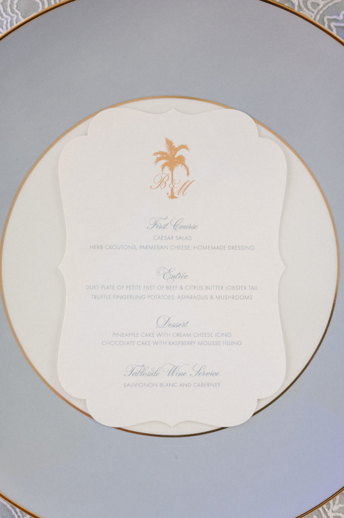 Wedding menu card with gold palm tree and monogram 