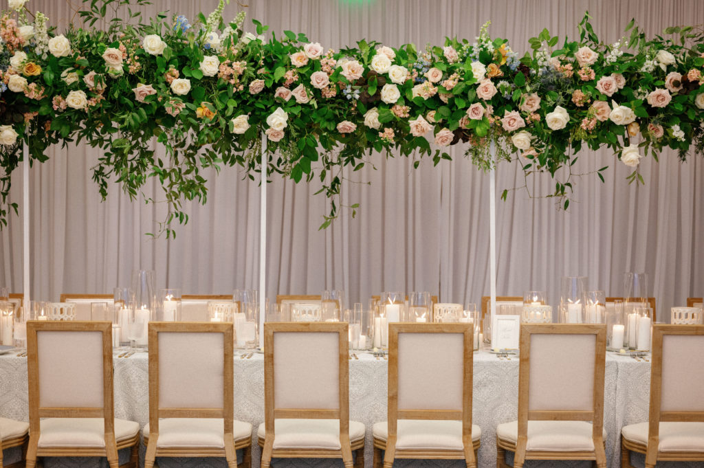 Head table design with overhead florals, LaPlaya Beach Resort Wedding