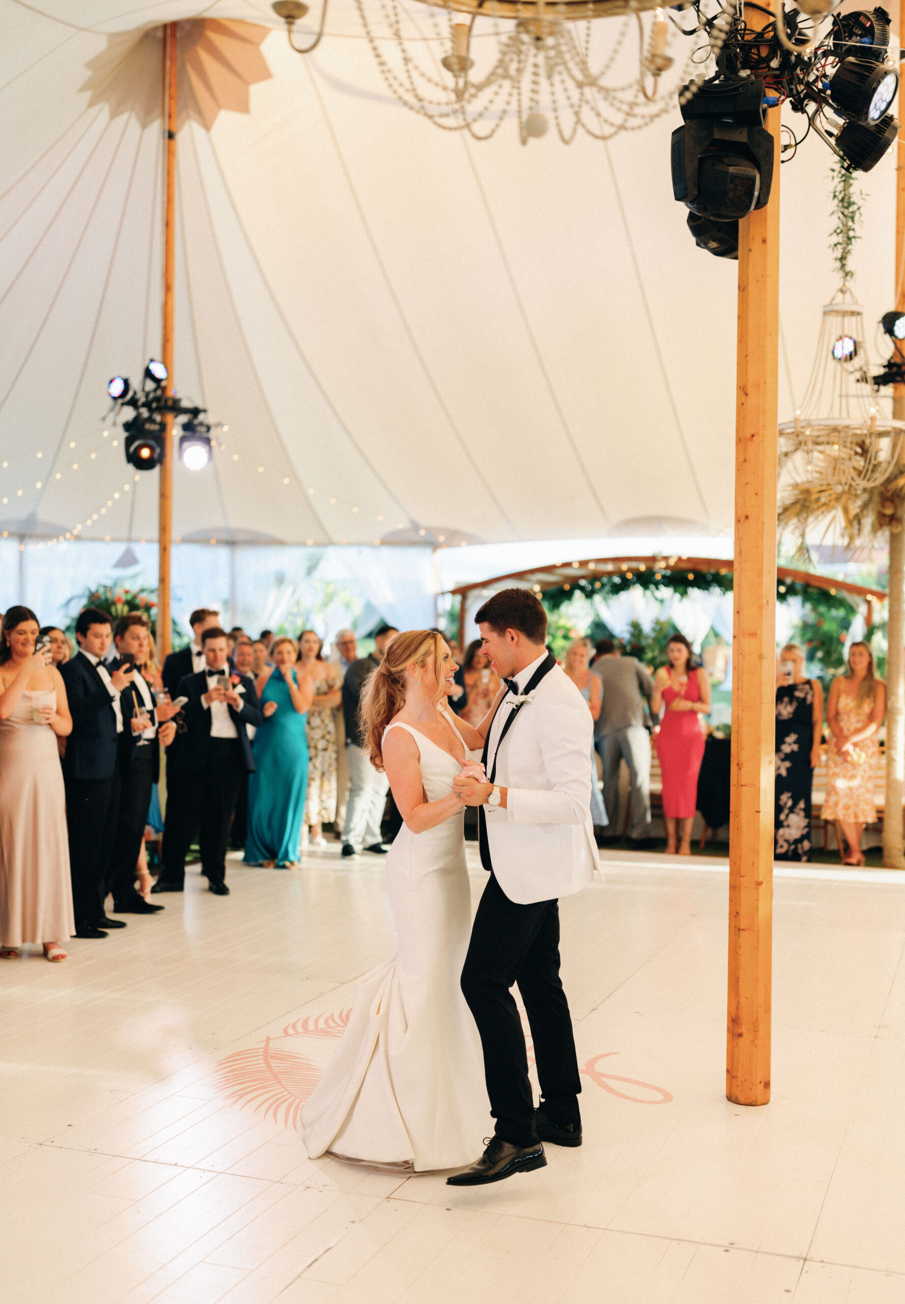 bride and groom dancing on monogrammed dance floor
