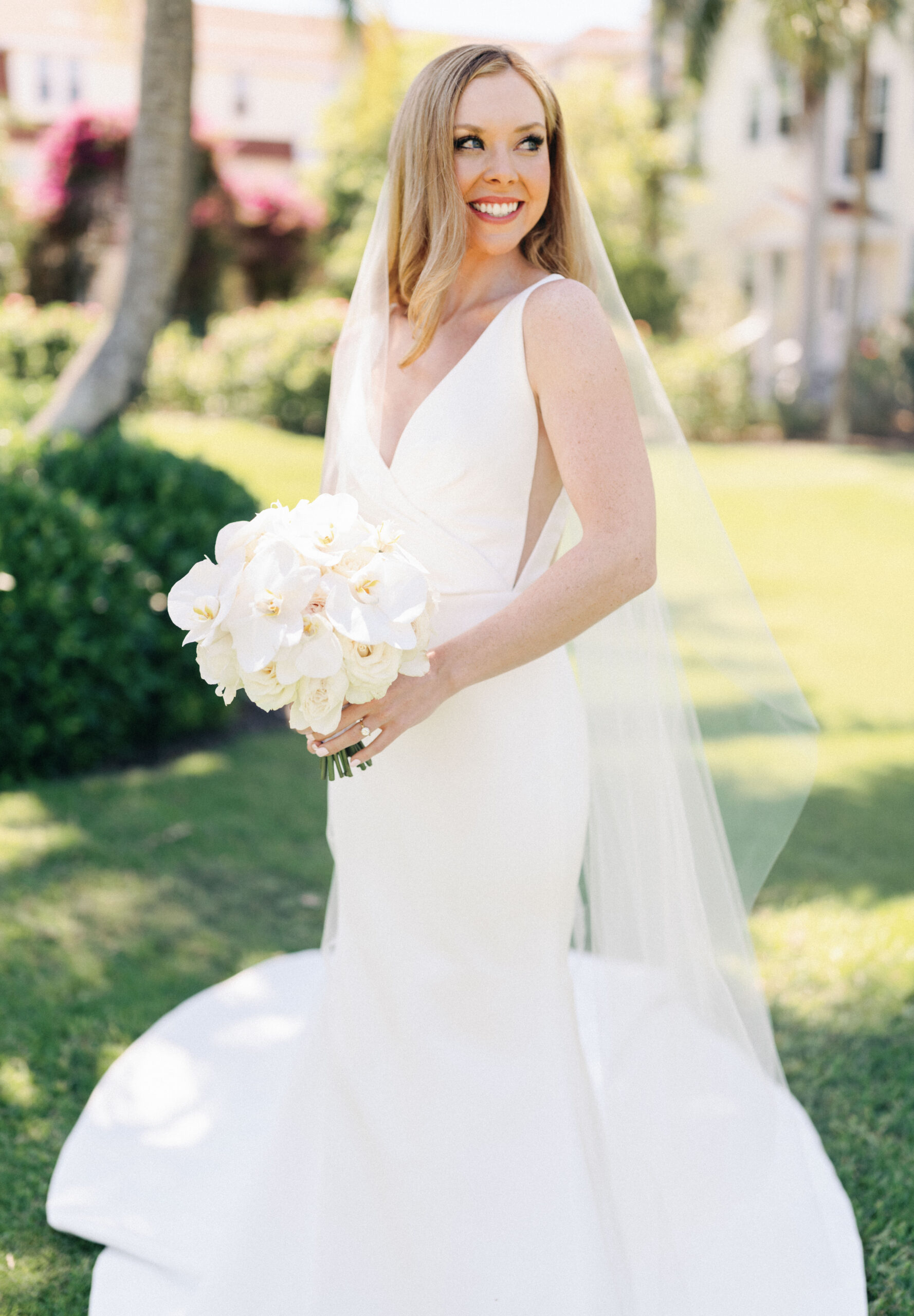 bride with all white orchid bouquet at Gasparilla Club