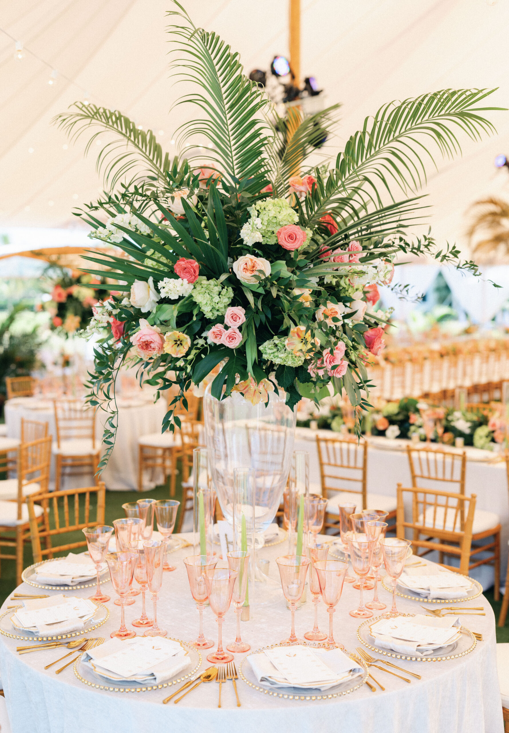 dramatic, tropical foliage centerpiece with pink accents