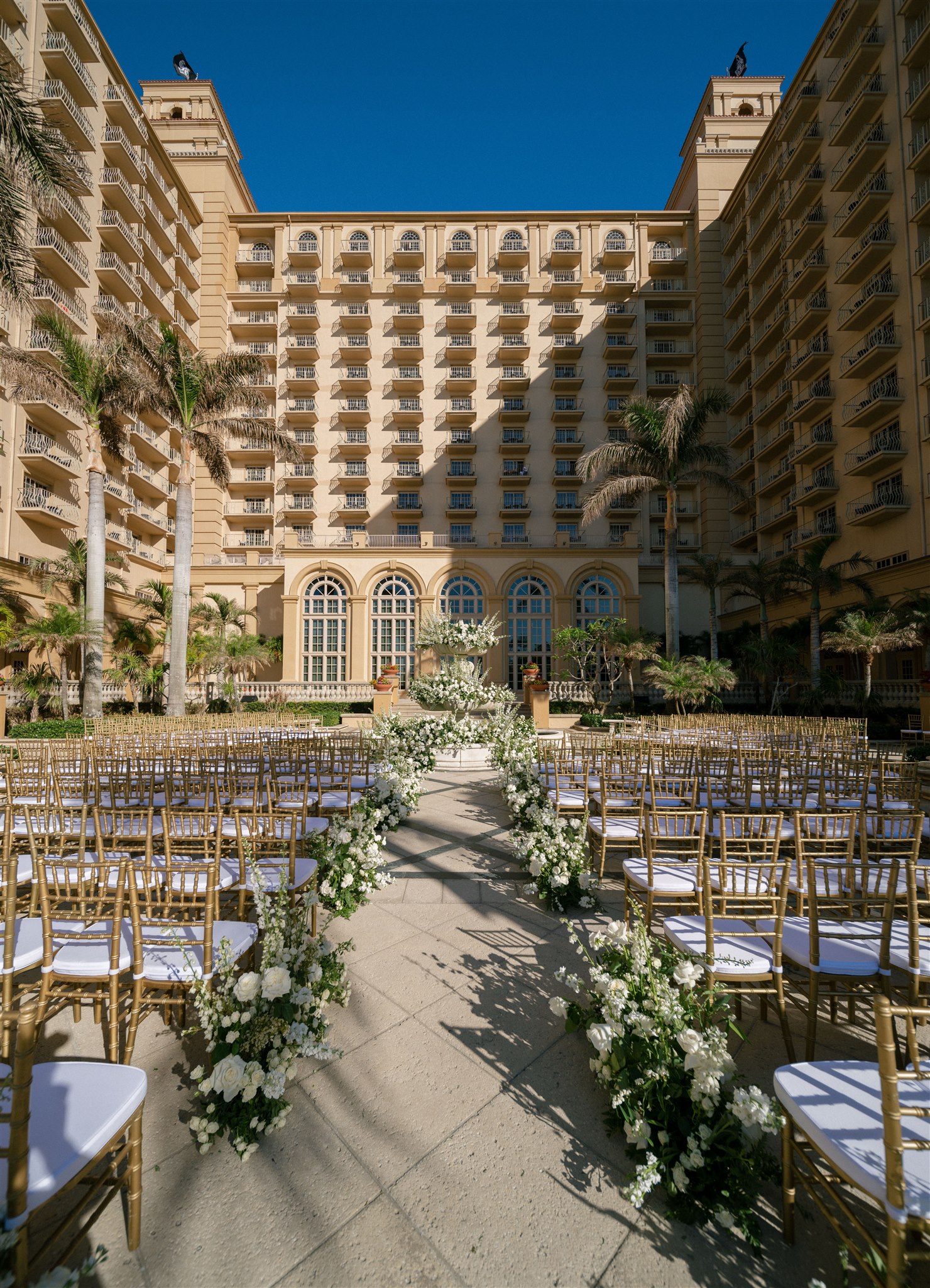 Floral and greenery lined aisle, outdoor ceremony at Ritz Carlton Naples