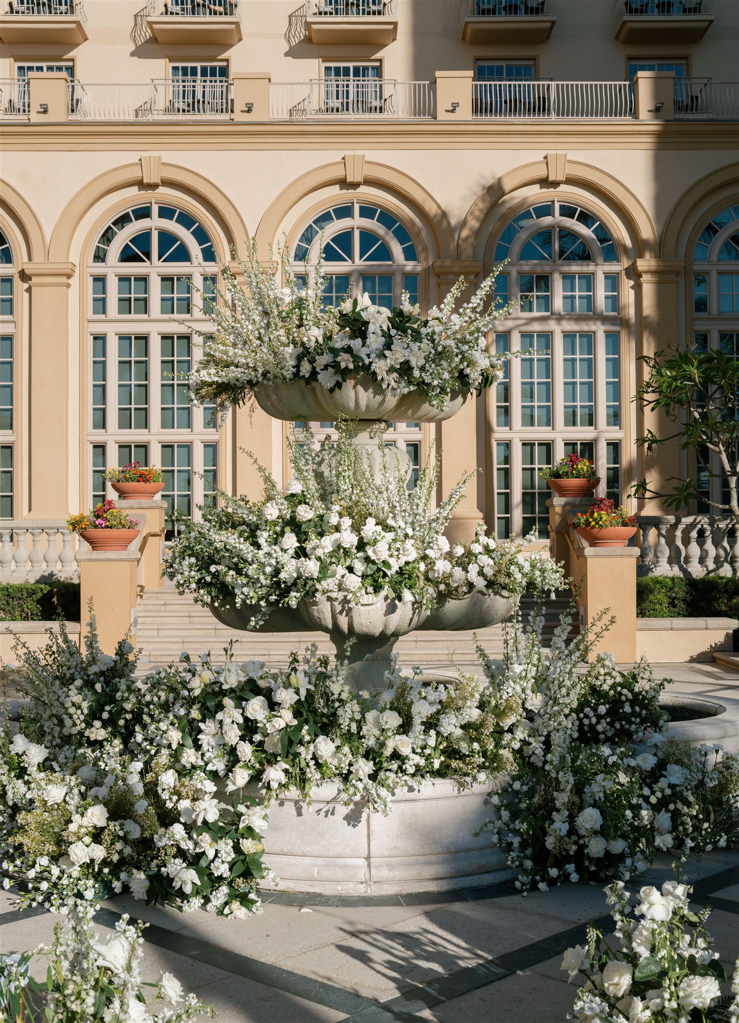 Outdoor wedding ceremony at Ritz Carlton Naples with flowers in fountain