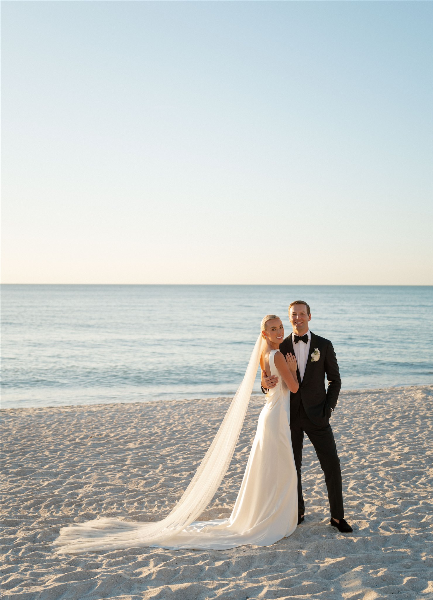 Couple on beach in front of Ritz Carlton Naples