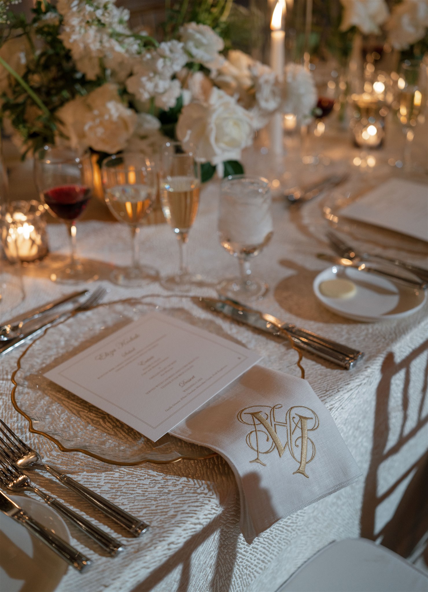 Gold and champagne wedding tablescape with custom monogrammed napkin