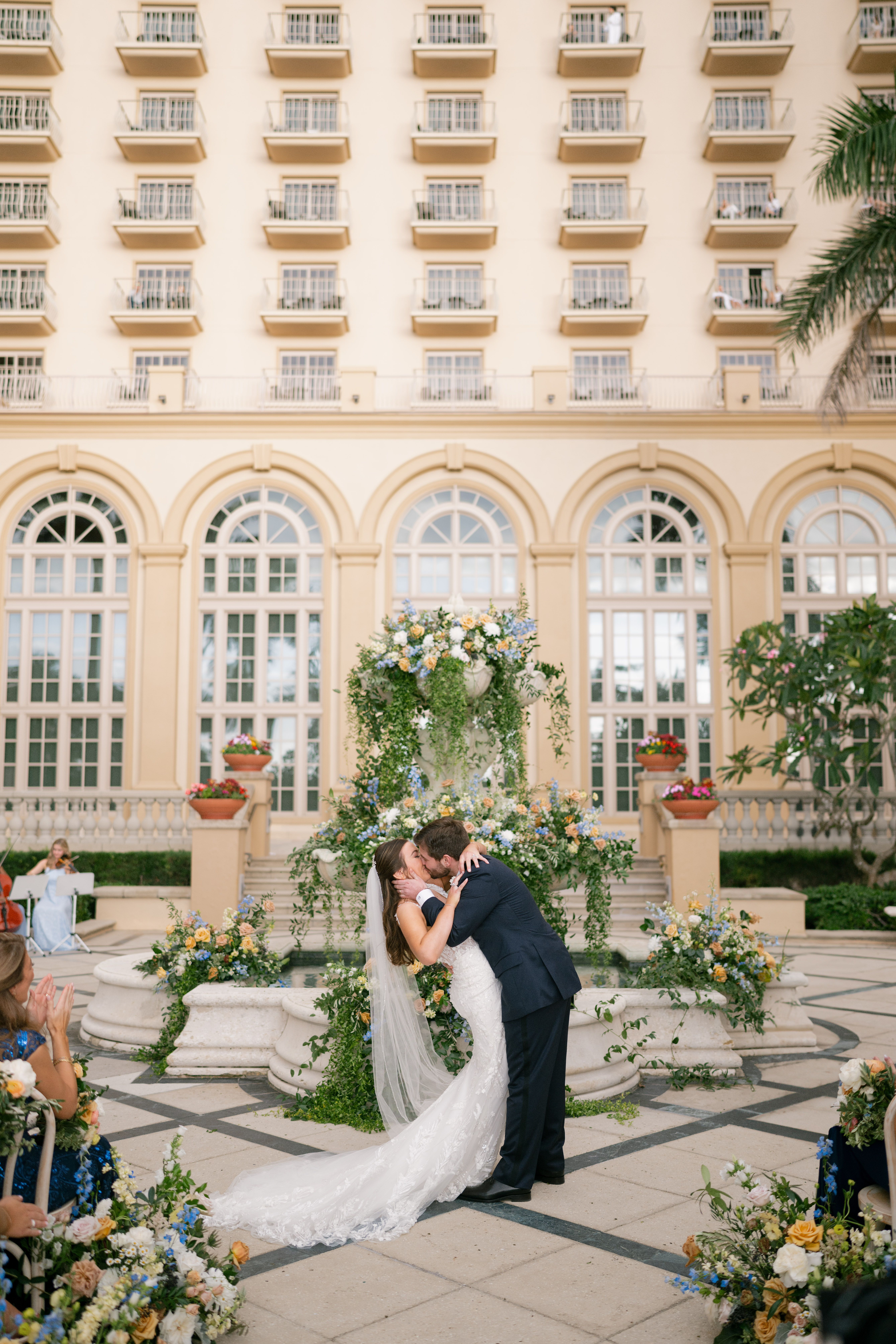A couple share their first kiss at the alter at the Ritz Carlton Naples Beach, Florida.
