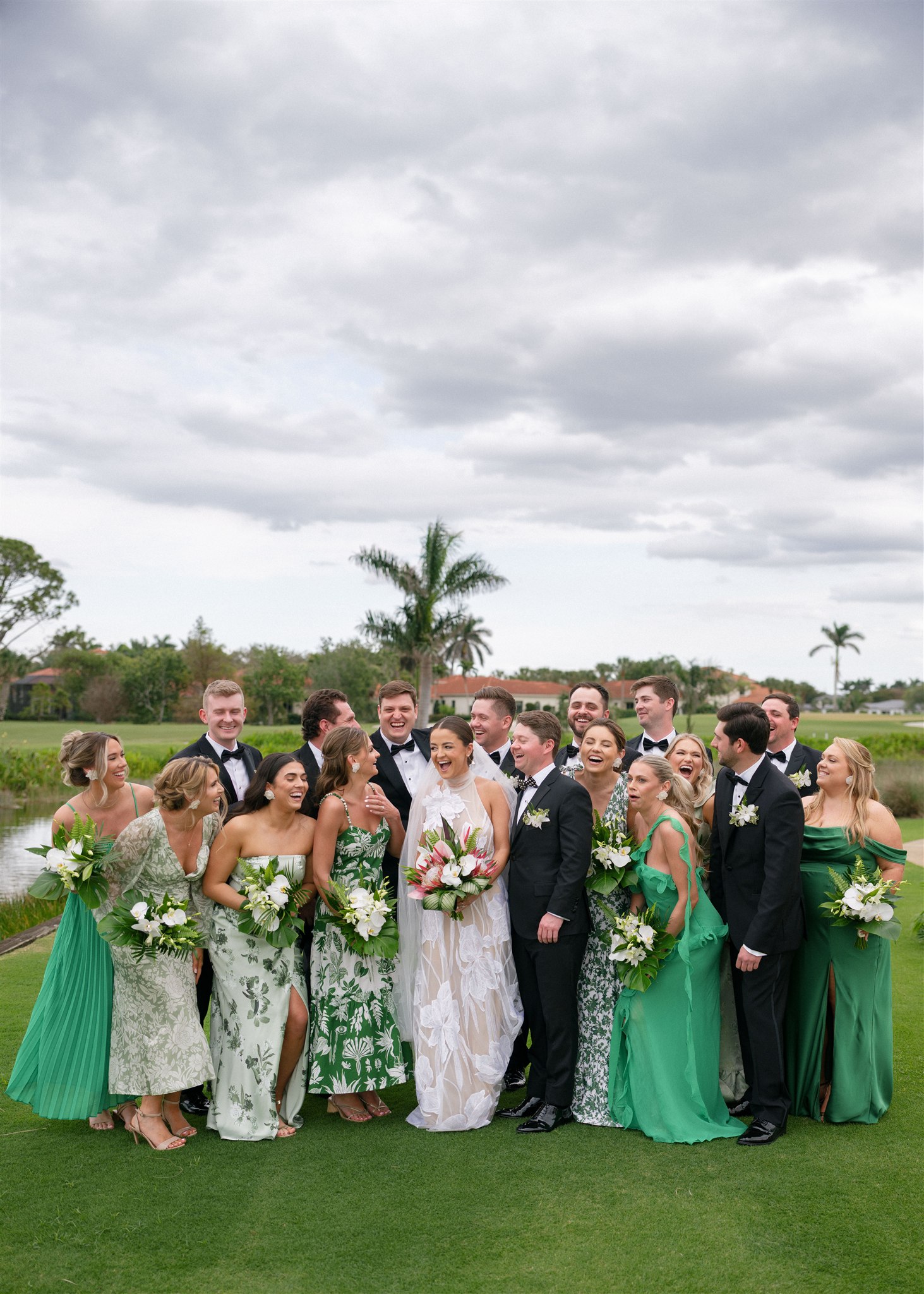Bridal party portraits beneath the palm trees.