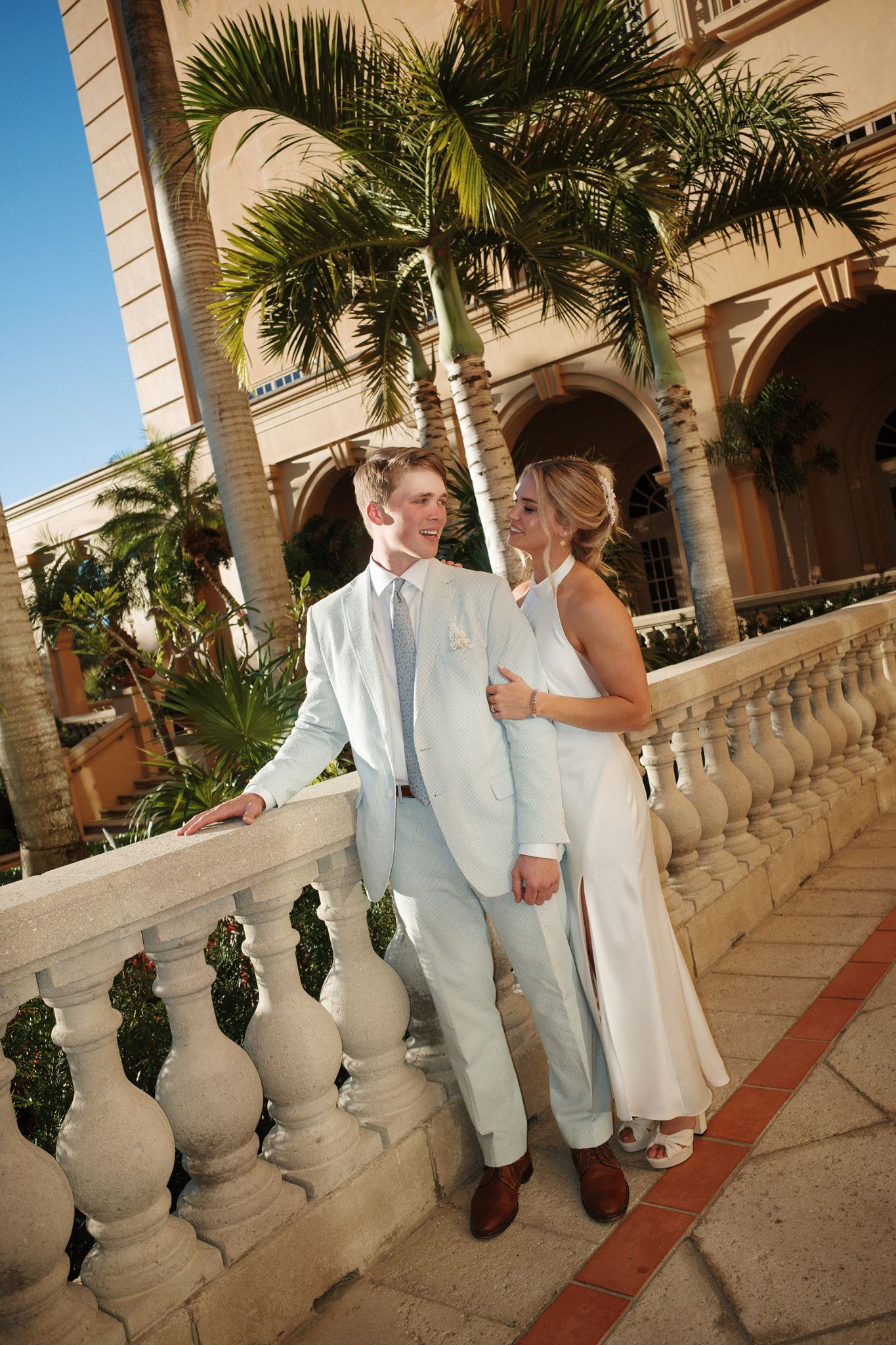 A bride and groom-to-be pose at the Ritz Carlton Naples during their rehearsal dinner.
