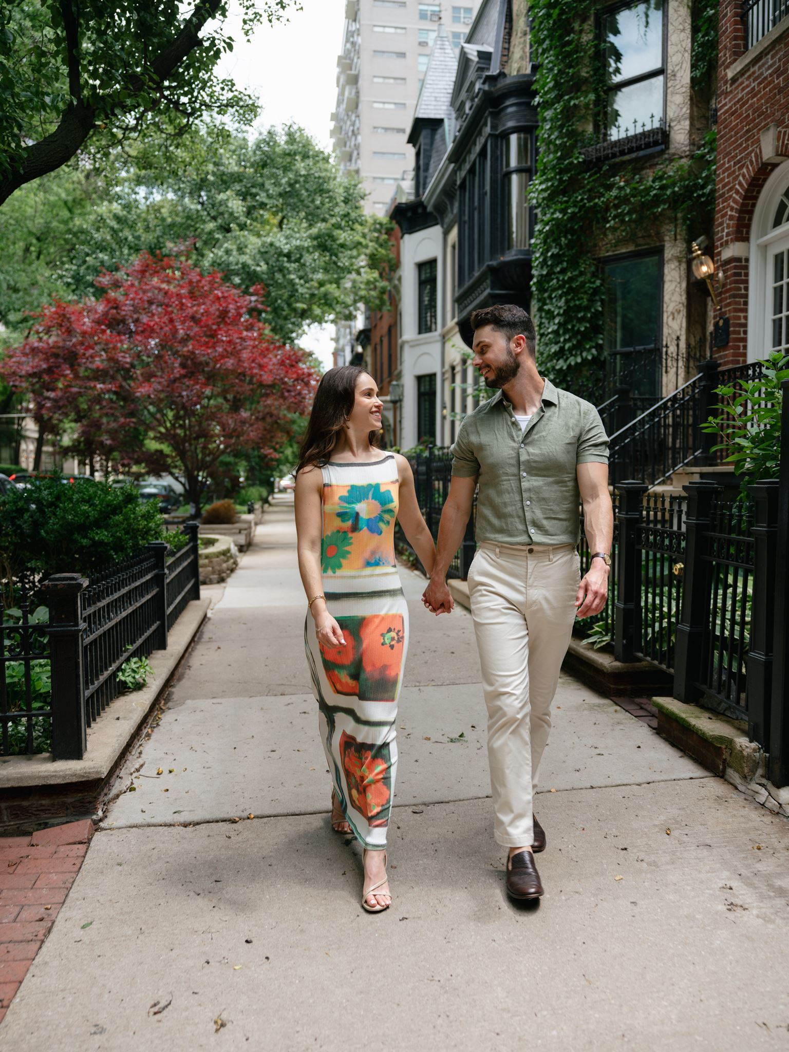 An engaged couple posing for an engagement session in downtown Chicago.